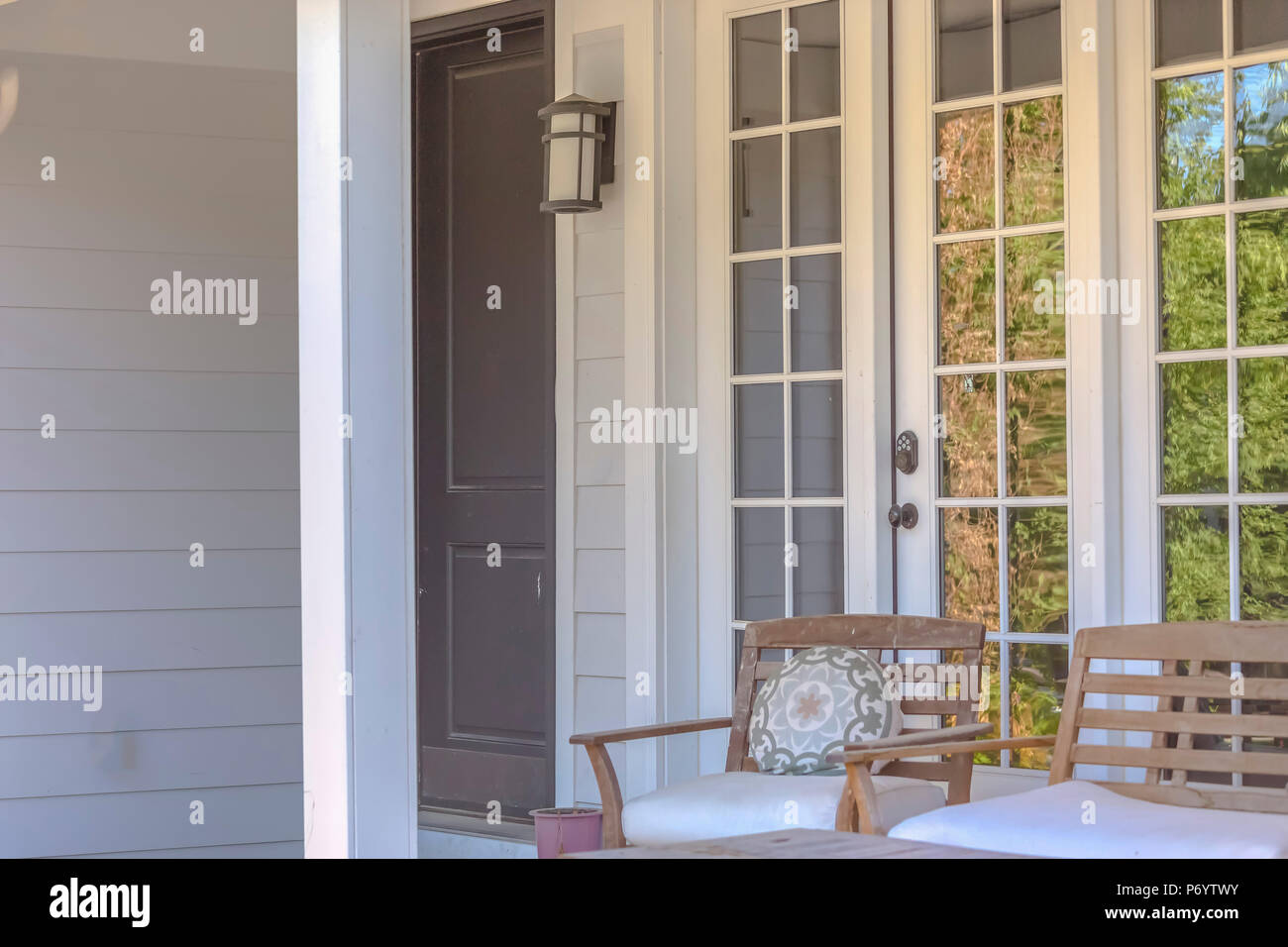 Front door with outdoor seating Stock Photo Alamy