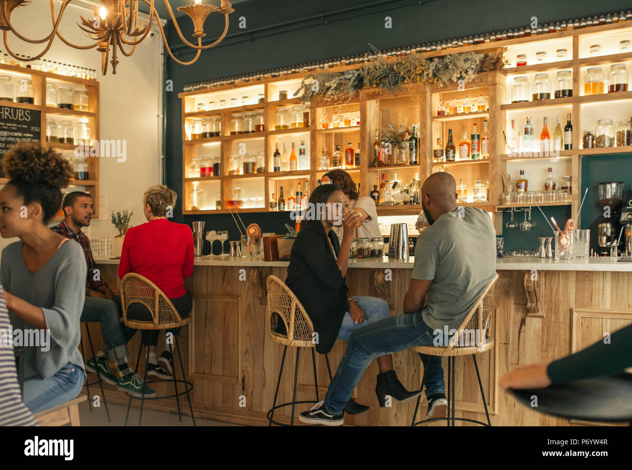 Young African American couple having drinks together in a bar Stock Photo