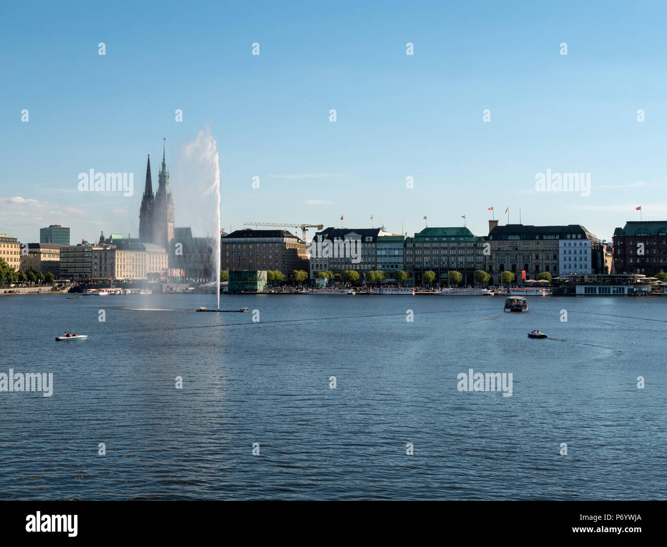 Hamburg, Germany - July 02, 2018: People enjoy the fine weather at Alster Lake in Hamburg Germany on pedal boats and round trips. Stock Photo