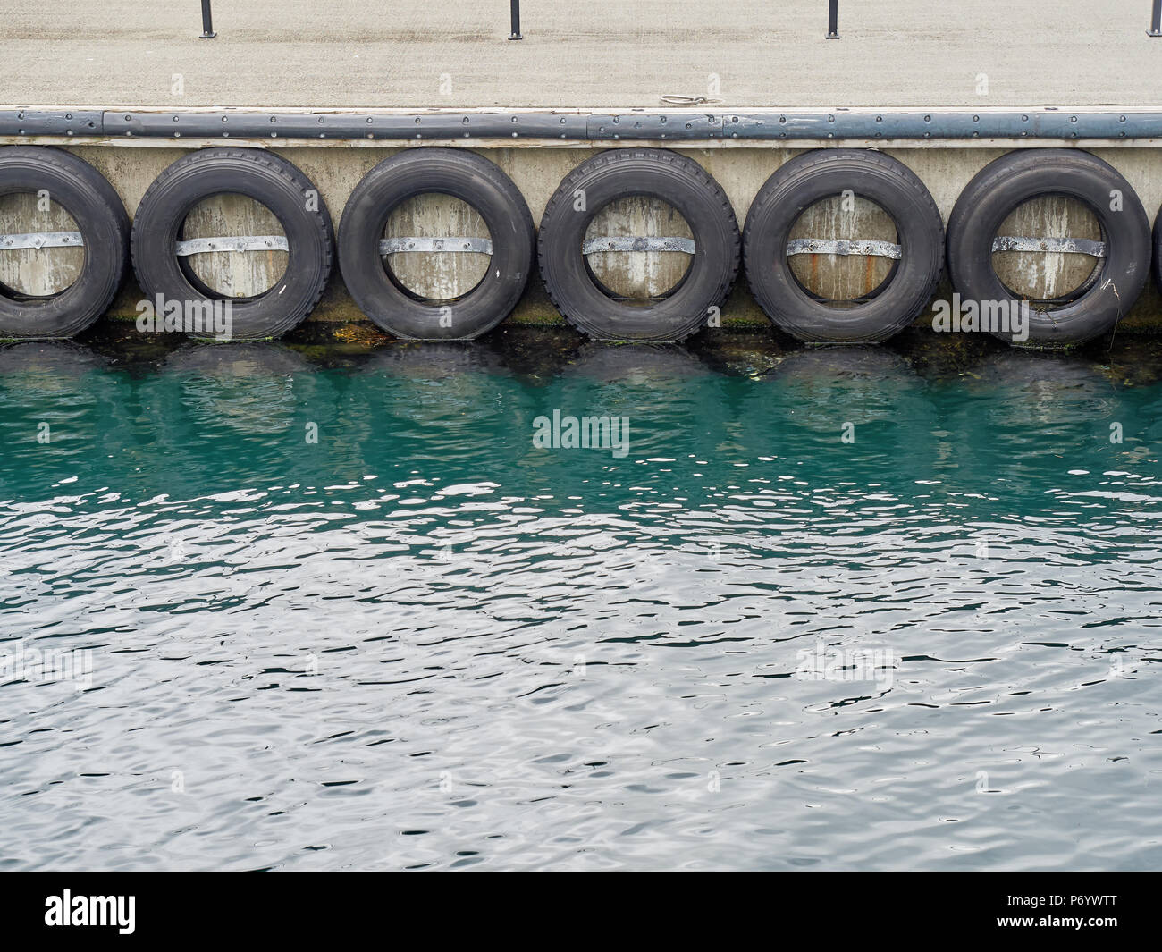 Car tyre on pier as bumpers Stock Photo Alamy