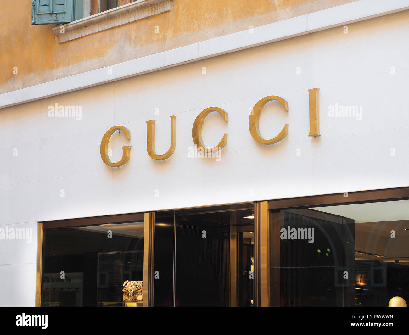 Verona, Italy - August 2016: golden Gucci sign of a store Stock Photo -  Alamy