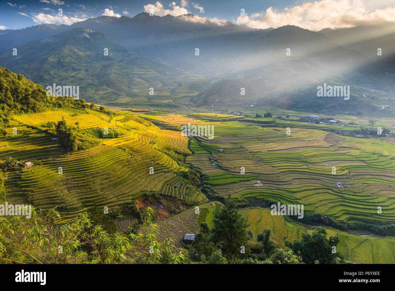 Sun beams over the mountains surrounding the rice terraces at Tu Le, Yen Bai Province, Vietnam, South-East Asia Stock Photo