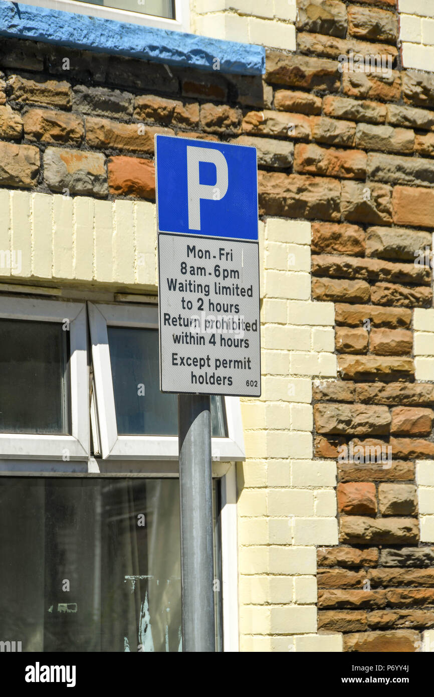 Road sign informing motorists of parking restrictions on the street