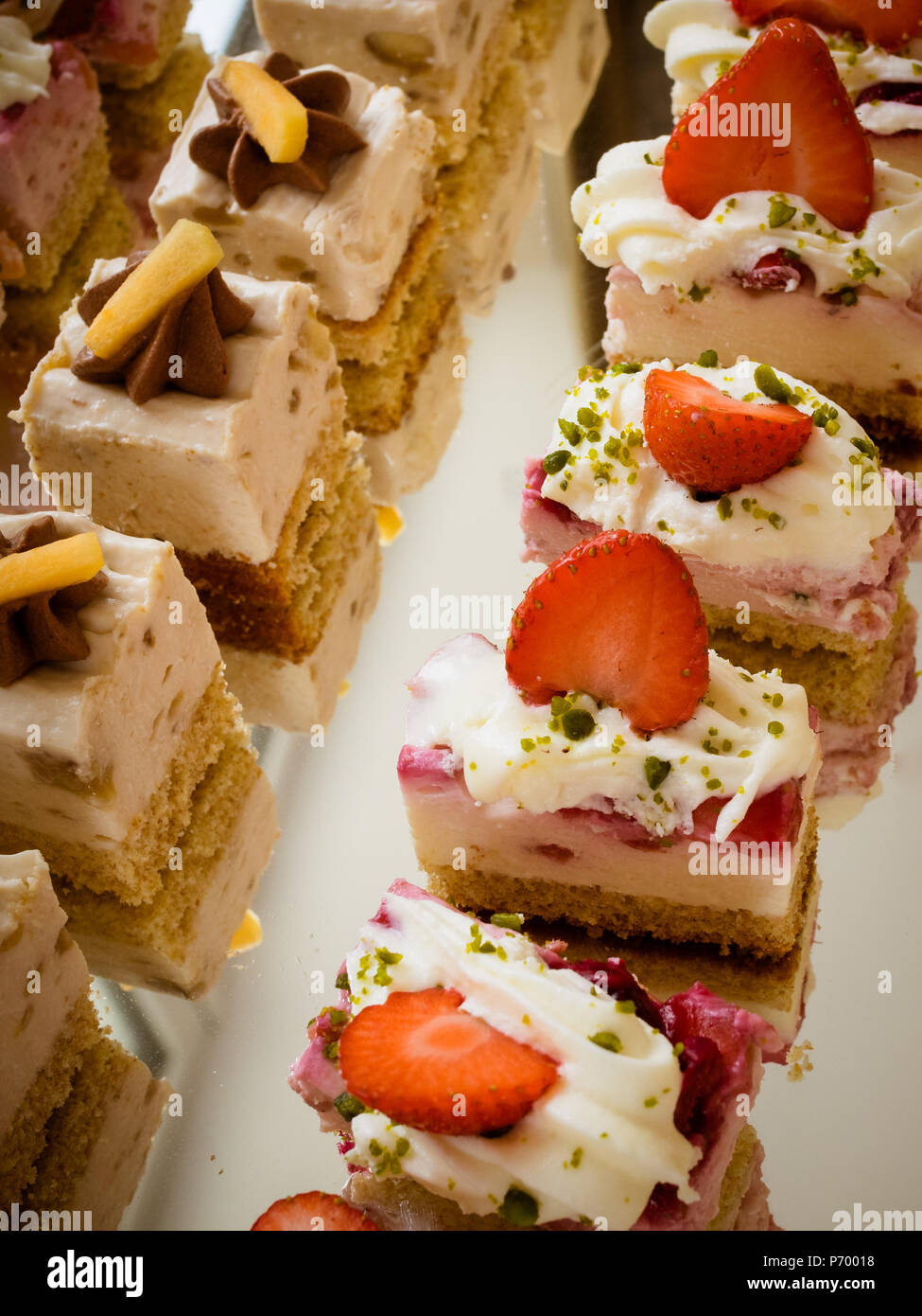 Wedding cakes set on glass shelf minicake Stock Photo