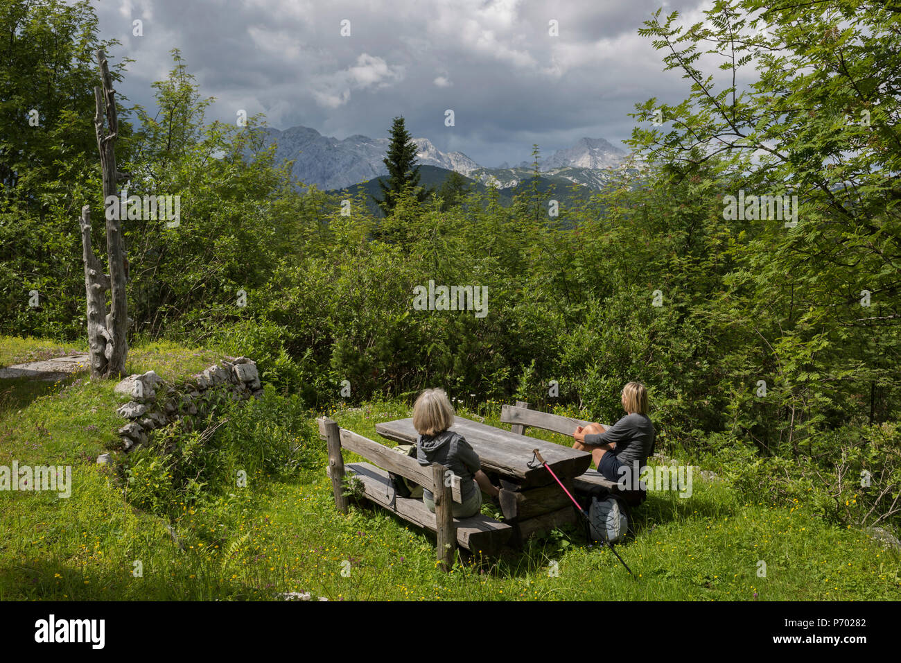 Walkers Rest At A Picnic Table That Overlooks The Jighest Of