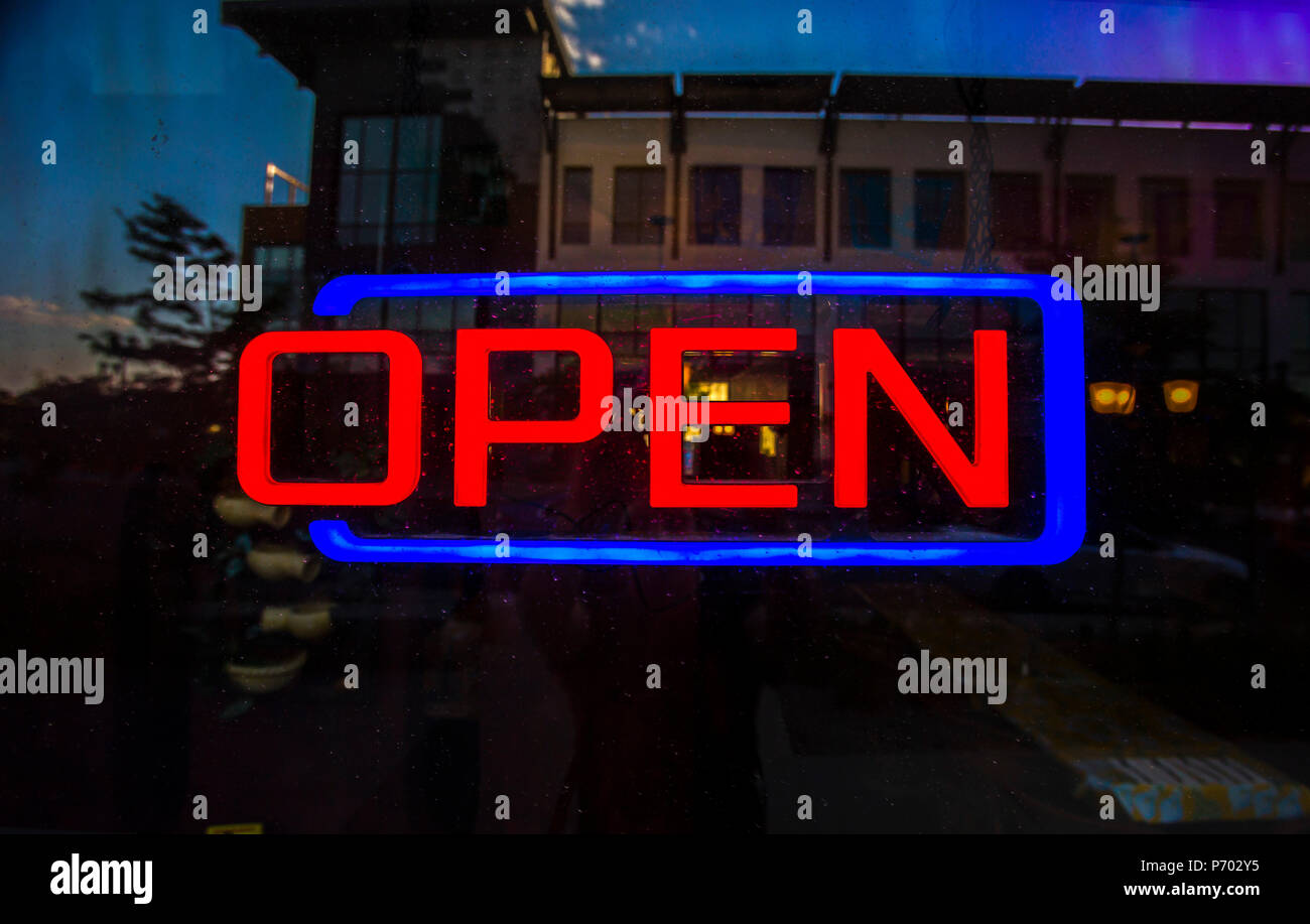 Open sign outside of restaurant Stock Photo