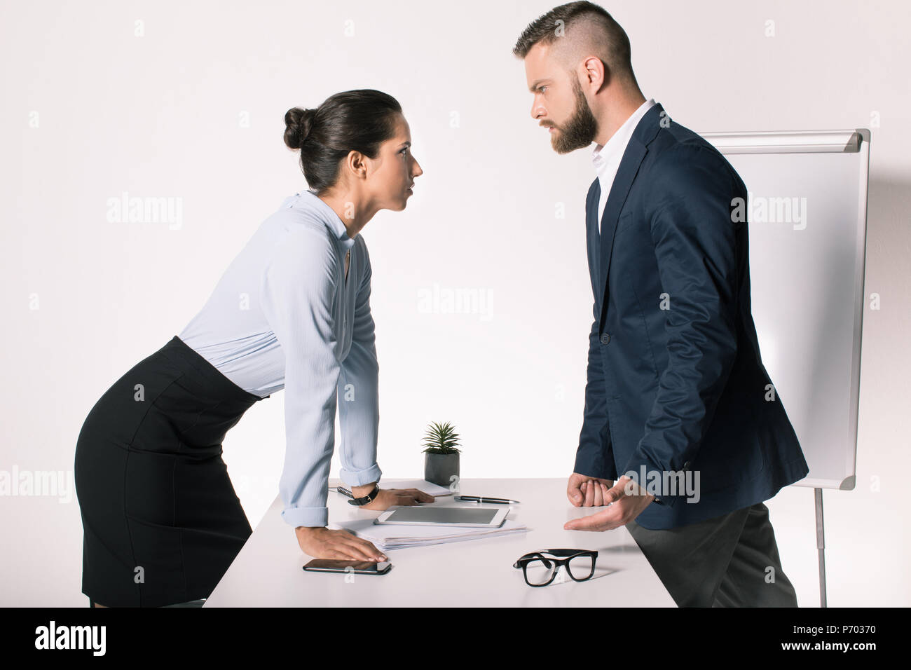 serious business people having disagreement and looking at each other in office Stock Photo
