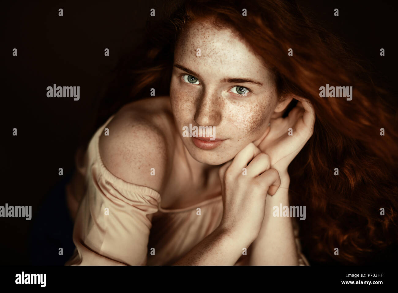 Attractive Tender Freckled Redhead Woman Looking At Camera Isolated On