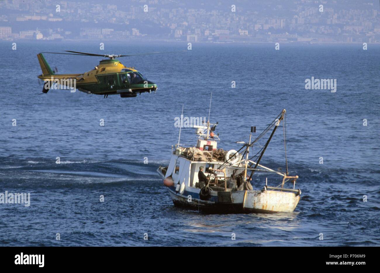 Italian finance police, helicopter controls a fishing vessel  in the Gulf of Naples Stock Photo
