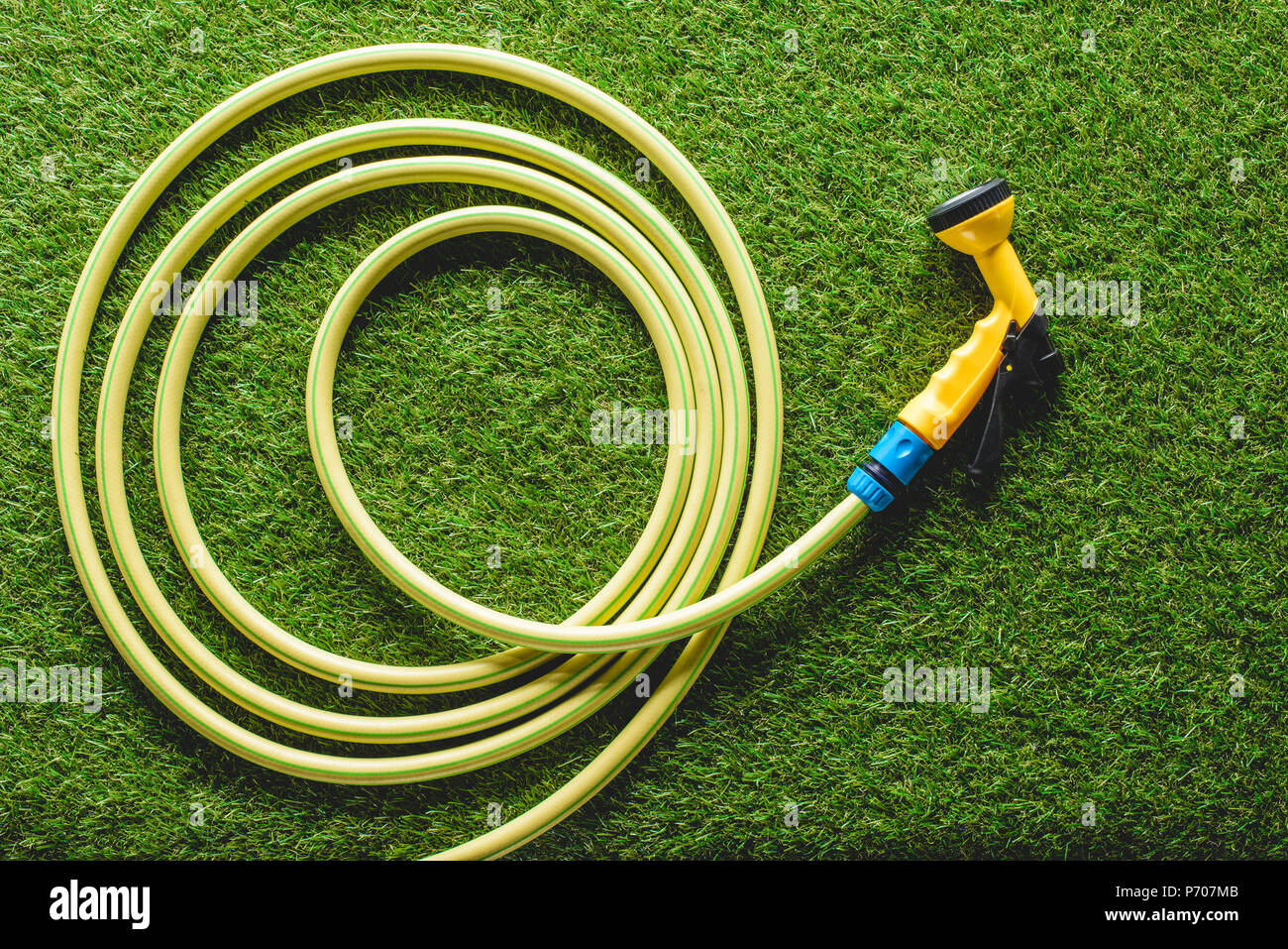 top view of hosepipe on grass, minimalistic conception Stock Photo