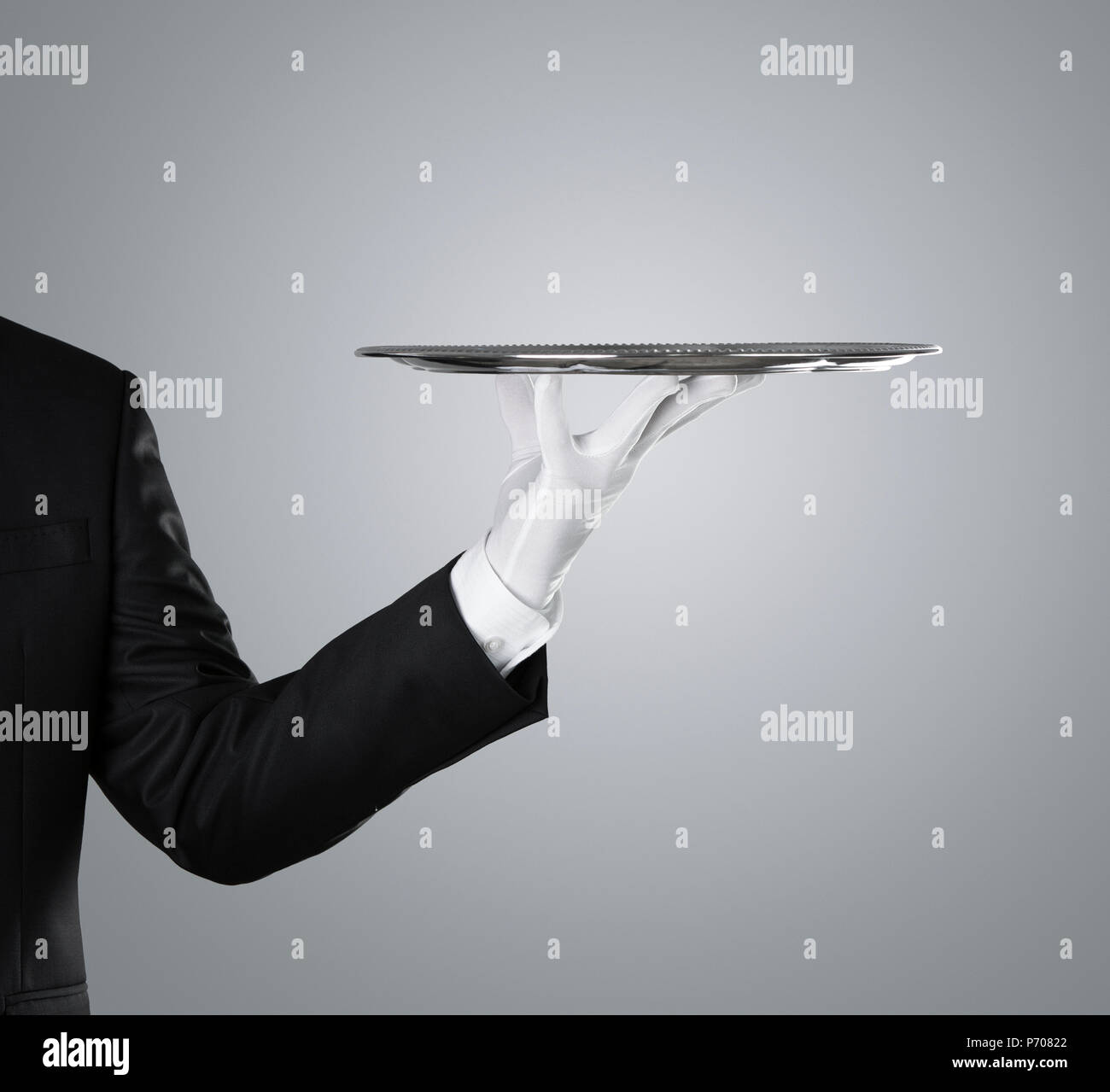 Waiter with empty silver tray Stock Photo