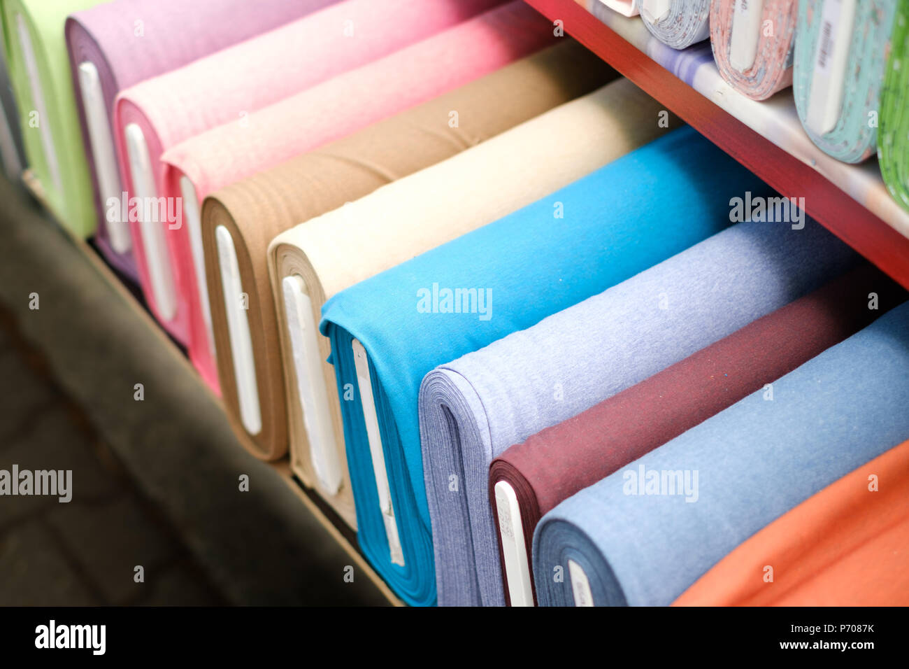 colorful fabric rolls on textile market Stock Photo