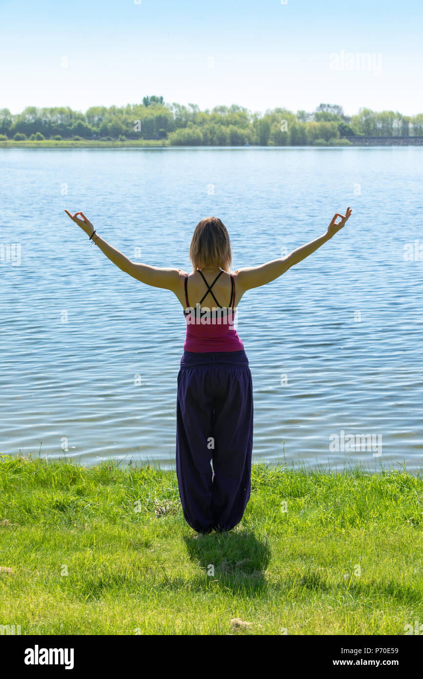 Premium Photo | Beautiful outdoor yoga by young woman