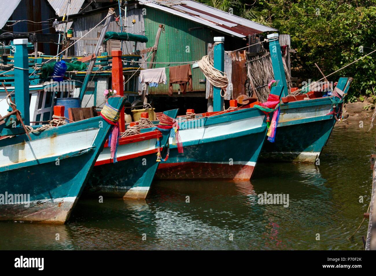 Fishing boats lined up in a fishing village in Cambodia Stock Photo