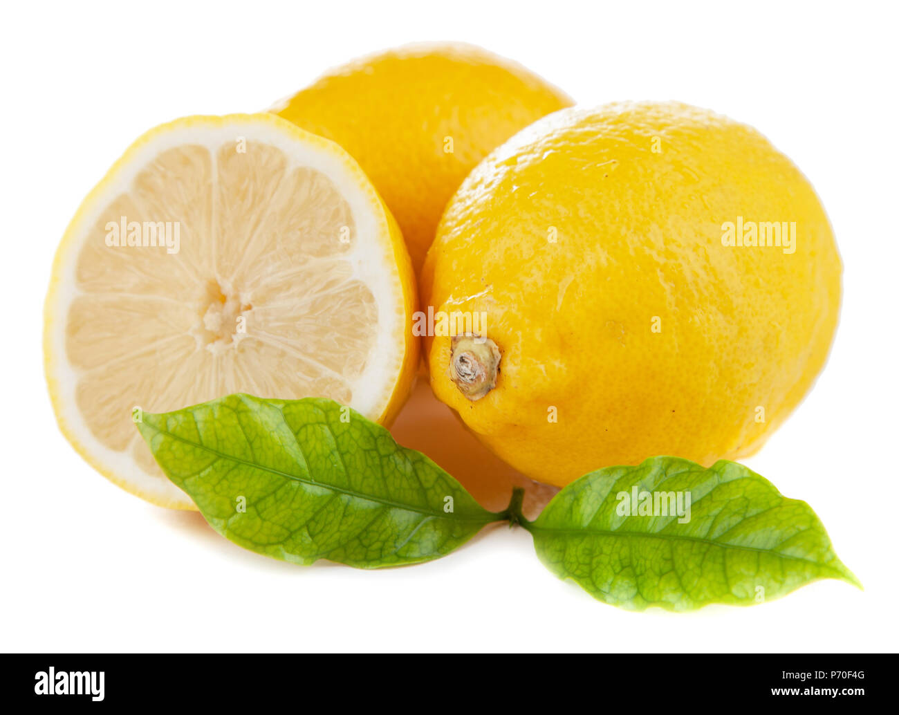 Fresh lemons with green leaves Stock Photo