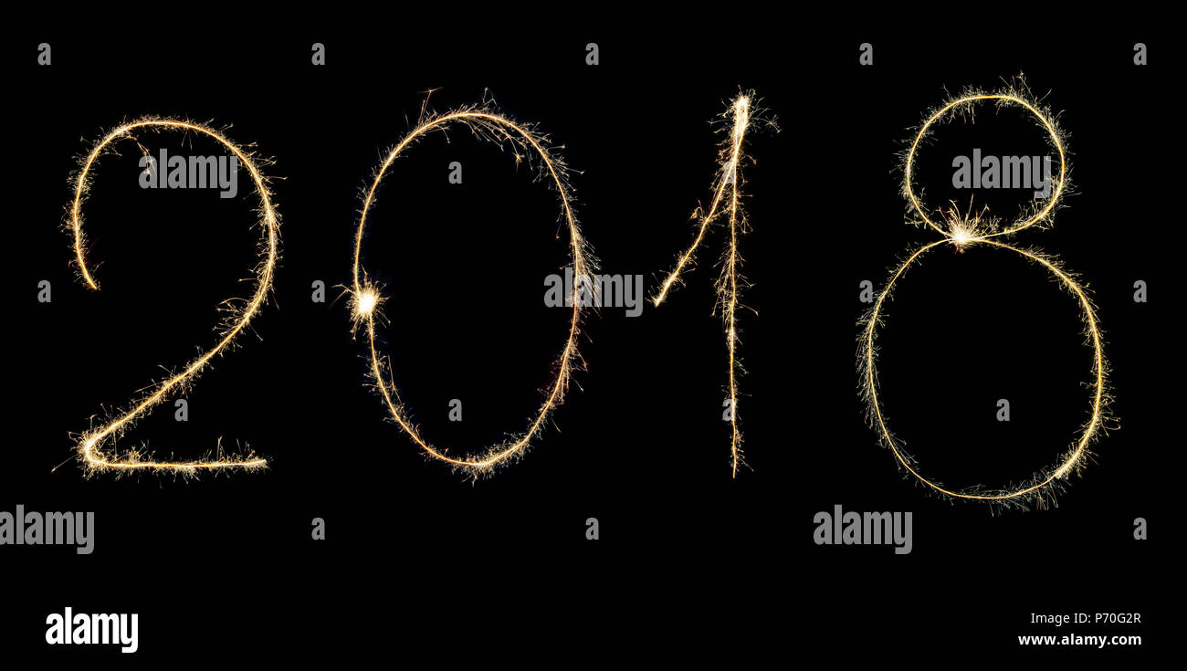 Luminous 2018 digits written with sparklers isolated on black background.Concept of New Year and Xmas Stock Photo