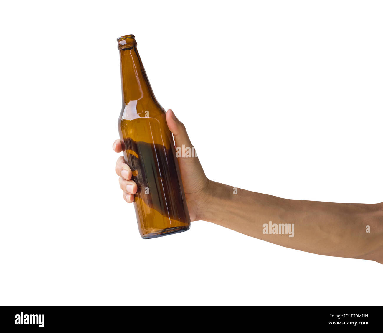 Hand holding beer bottle isolated on white background. Clipping path of transparent brown bottle without label. Stock Photo