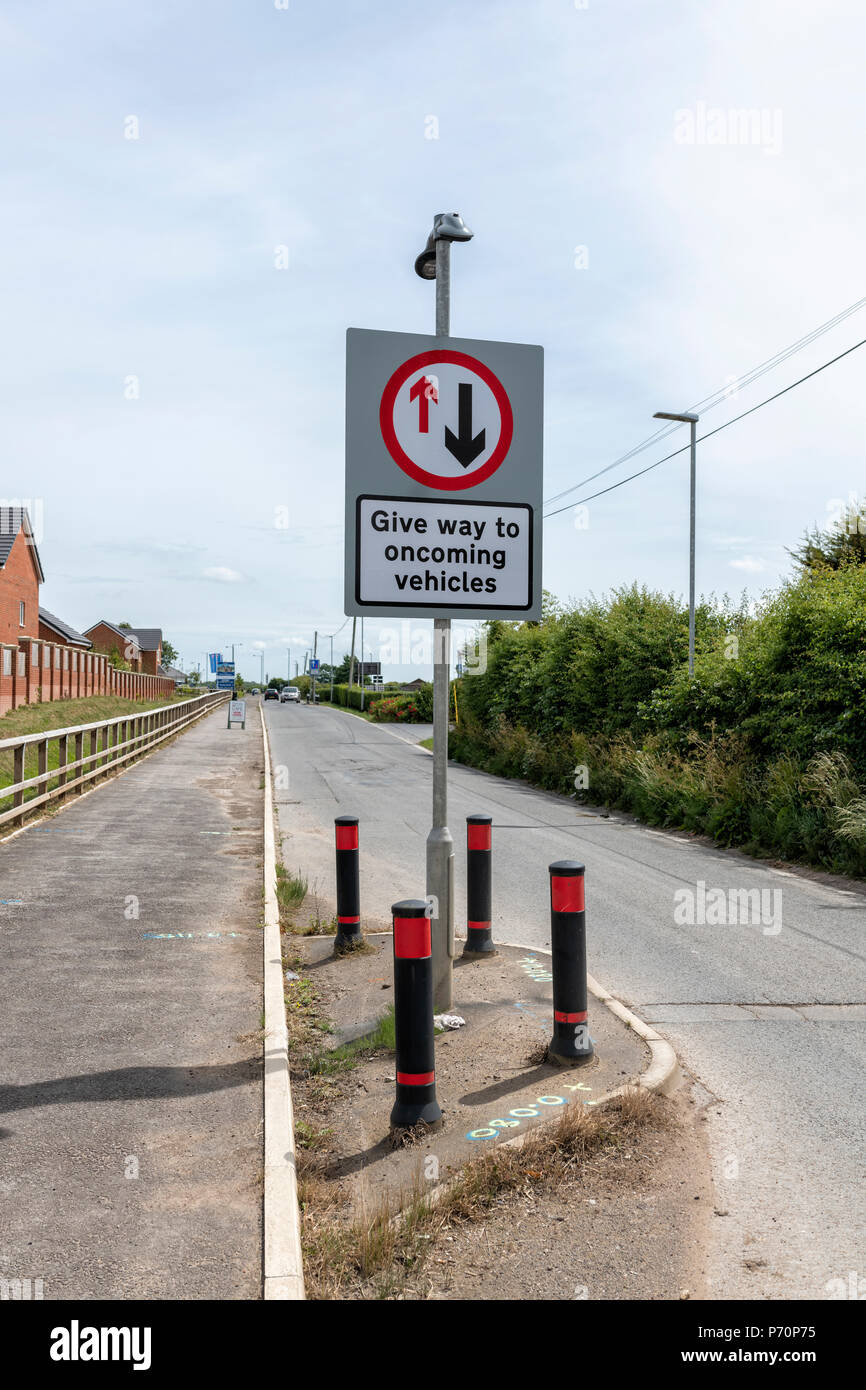 A 'Give way to oncoming vehicles' sign in Blackpool, Lancashire Stock Photo