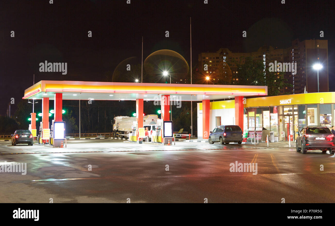 Gas Station at night with lights on and minimart Stock Photo Alamy