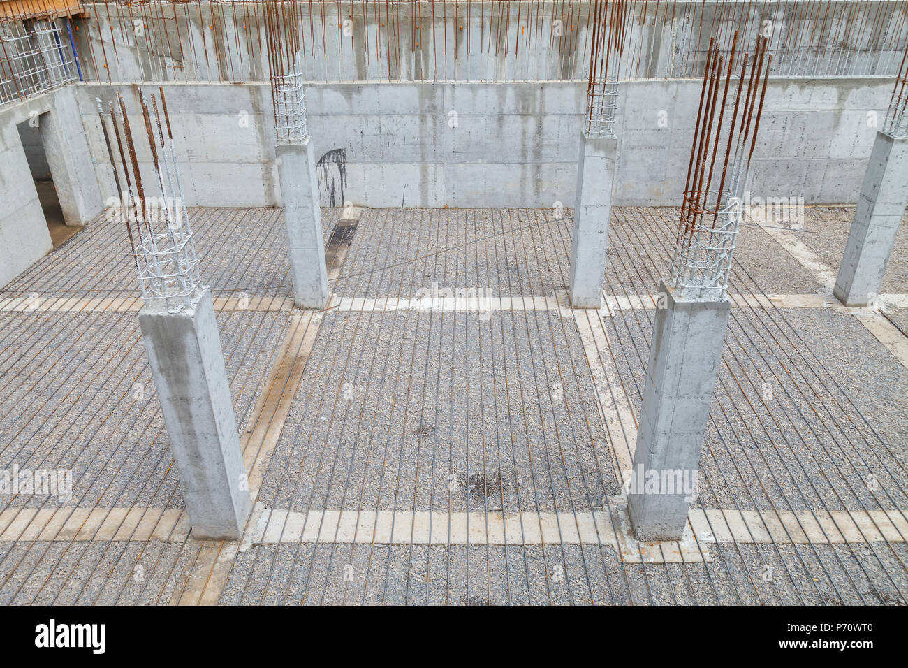 A grid of reinforcement laid on the surface ready for pouring concrete