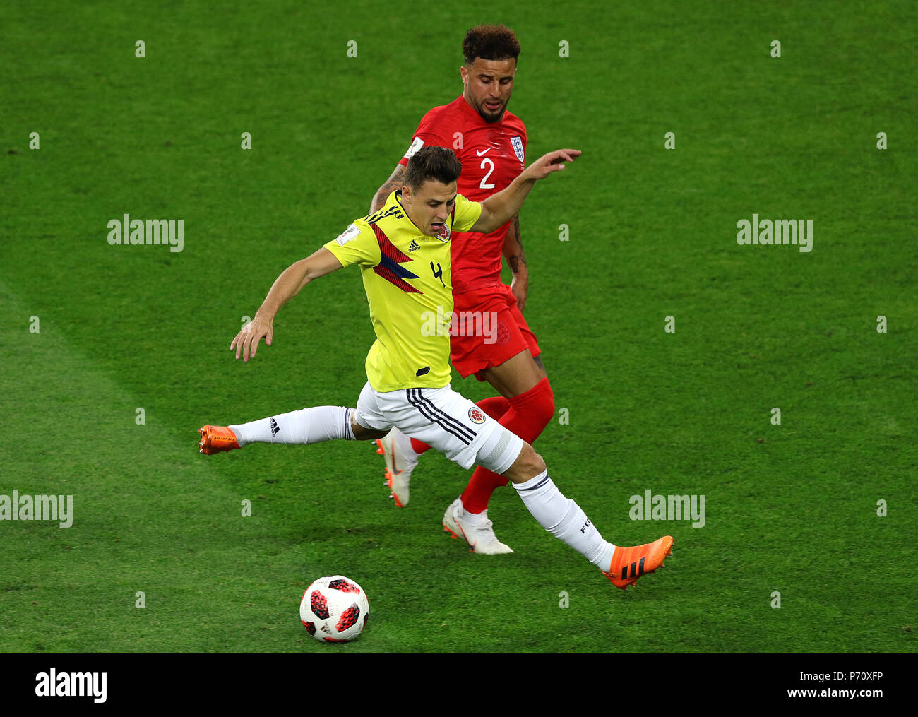 Colombia's Santiago Arias (left) and England's Kyle Walker battle for the ball during the FIFA World Cup 2018, round of 16 match at the Spartak Stadium, Moscow. Stock Photo