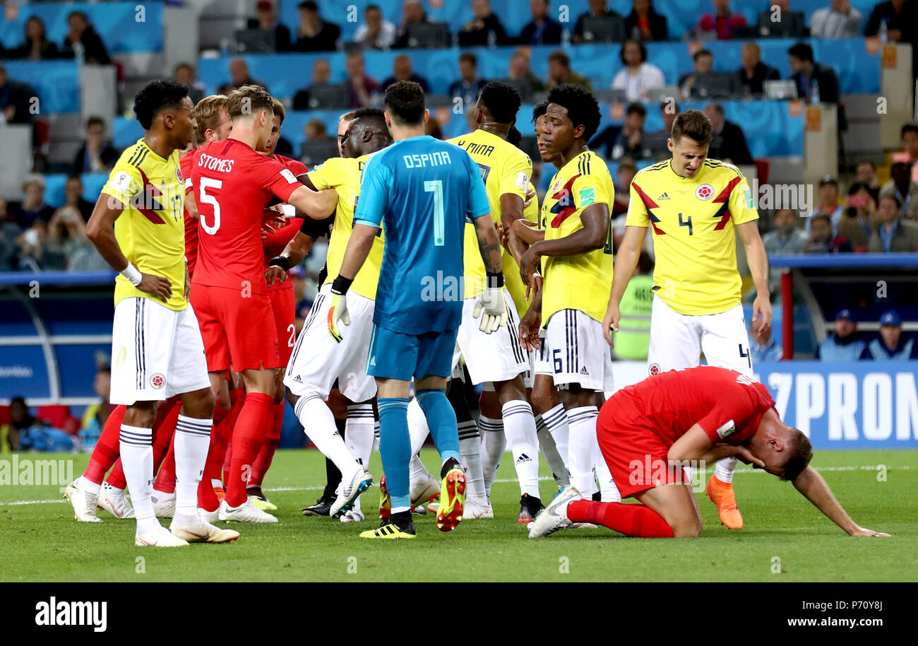 Tempers flare whilst England's Jordan Henderson (right) crouches on the floor after being head butted by Colombia's Wilmar Barrios during the FIFA World Cup 2018, round of 16 match at the Spartak Stadium, Moscow. Stock Photo
