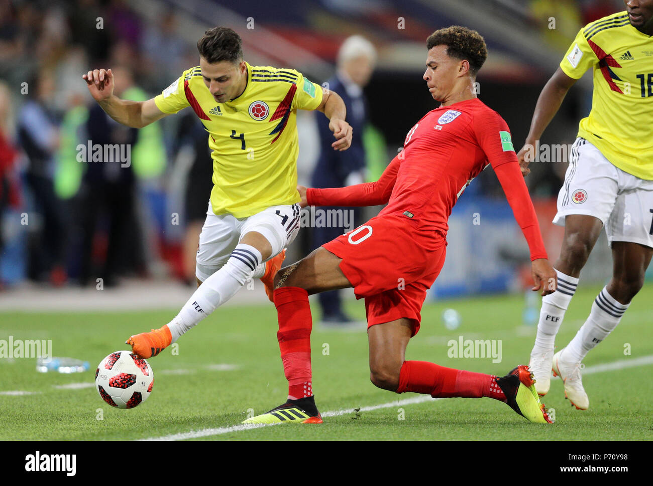 Colombia's Santiago Arias (left) and England's Dele Alli battle for the ball during the FIFA World Cup 2018, round of 16 match at the Spartak Stadium, Moscow. Stock Photo