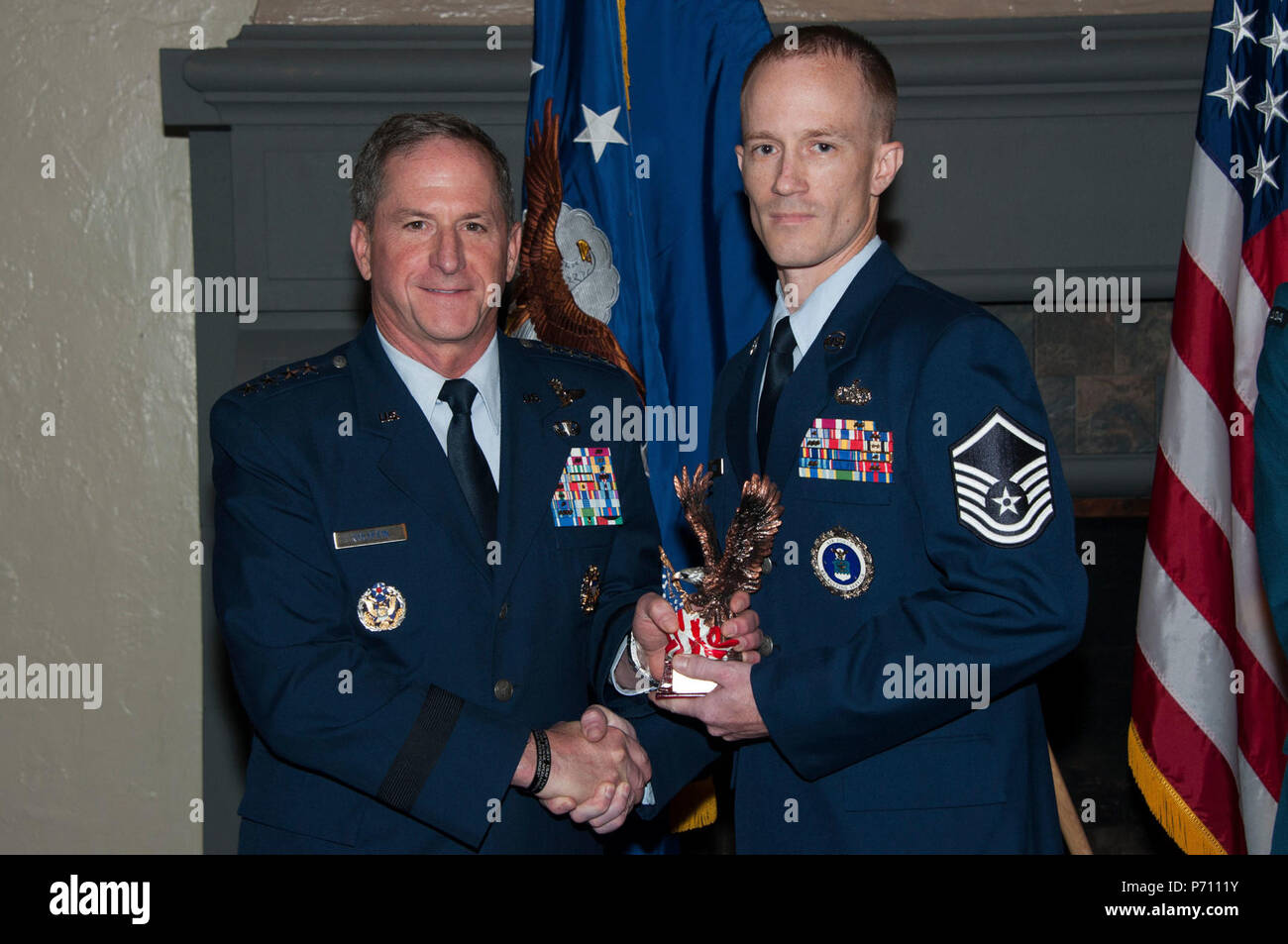 Maxwell AFB, Ala. - US Air Force Chief of Staff General David L. Goldfein presents the 2017 Secretary of the Air Force Leadership Award to Master Sergeant Christopher J. Kisse on May 10, 2017.  Kisse was the SECAF award winner from the Air Force Senior Non-Commissioned Officer Academy. (US Air Force Stock Photo