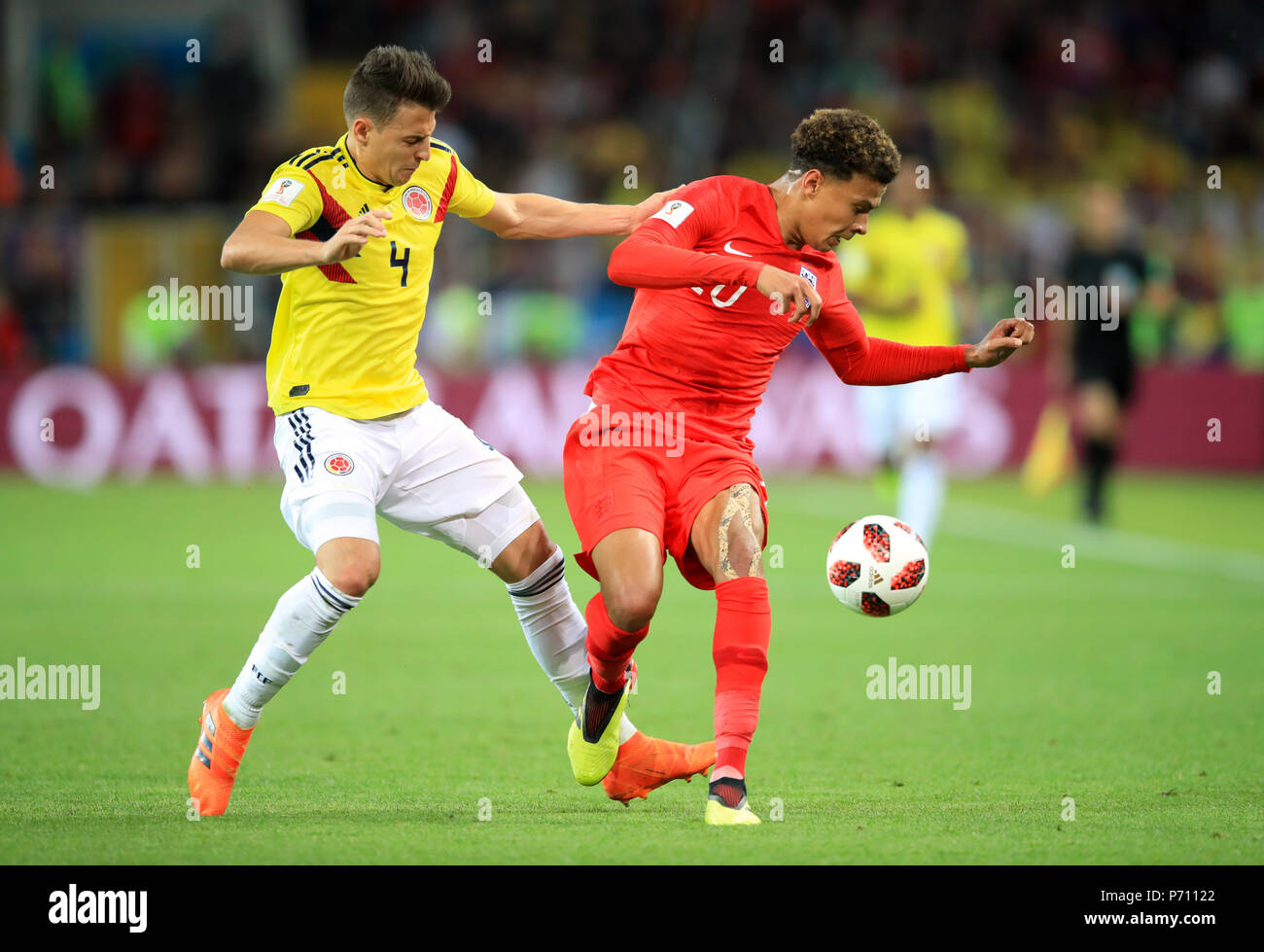 Colombia's Santiago Arias (left) and England's Dele Alli battle for the ball during the FIFA World Cup 2018, round of 16 match at the Spartak Stadium, Moscow. Stock Photo