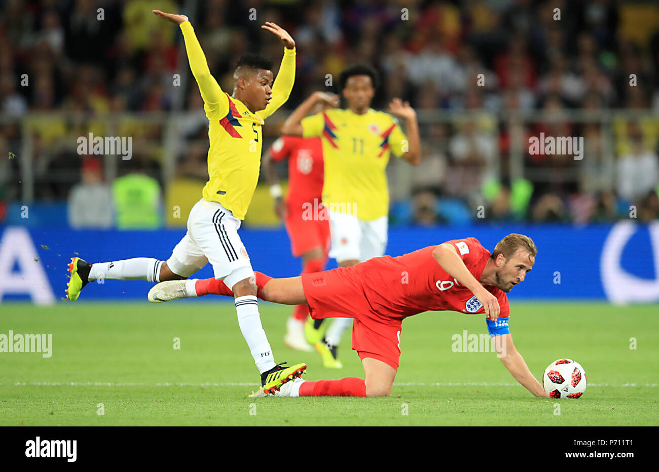 Colombia's Wilmar Barrios (left) and England's Harry Kane battle for the ballduring the FIFA World Cup 2018, round of 16 match at the Spartak Stadium, Moscow. Stock Photo