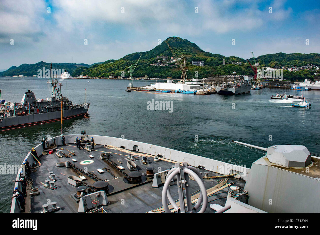SASEBO, Japan (May 11, 2017) The amphibious transport dock USS Green Bay (LPD 20) returns to its forward-deployed base of Sasebo, Japan during the ship’s Mid-Cycle Inspection (MCI). Green Bay, assigned to Commander, Amphibious Squadron 11, is conducting its MCI, which is conducted at the mid-year point prior to the Board of Inspection and Survey (INSURV) and is used to inspect and assess the material conditions of a ship. Stock Photo