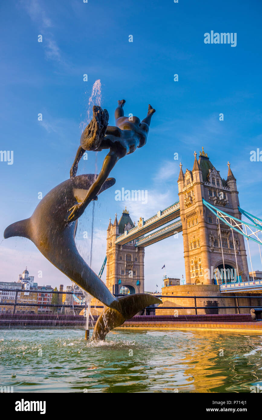 Tower Bridge over River Thames, Girl with a Dolphin fountain by David Wynne, London, England, United Kingdom, Europe Stock Photo
