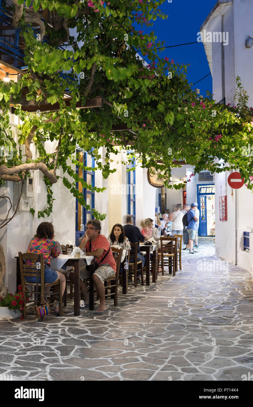 Outdoor restaurant in the old town of Plaka at night, Plaka, Milos, Cyclades, Aegean Sea, Greek Islands, Greece, Europe Stock Photo