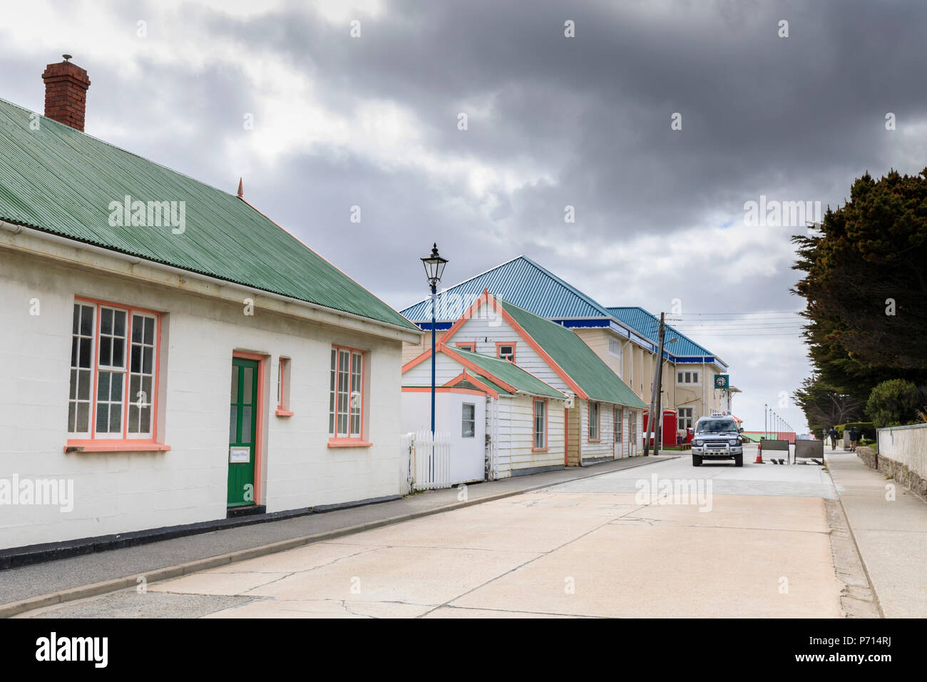 Traditional buildings with pastel iron roofs, Post Office, phone boxes, taxi, Central Stanley, Port Stanley, Falkland Islands, South America Stock Photo