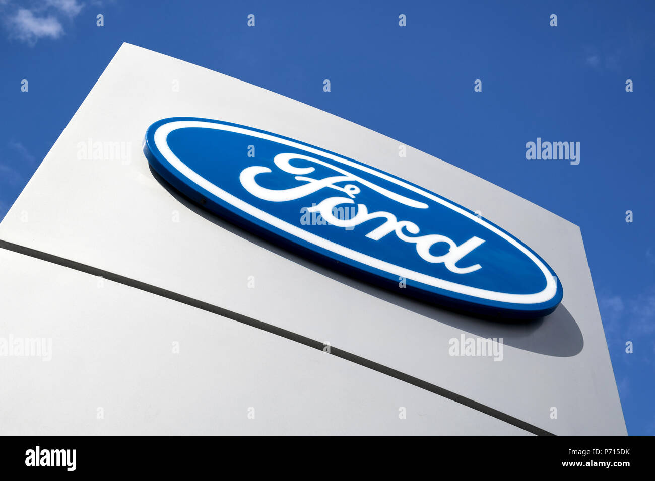 Ford dealership sign against blue sky. Ford is the secondlargest U.S