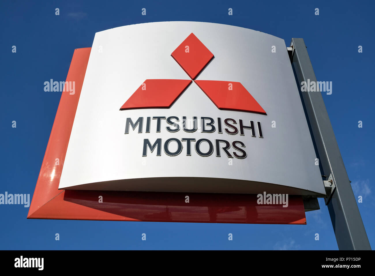 Mitsubishi dealership sign against blue sky. Mitsubishi  Motors is a Japanese multinational automotive manufacturer headquartered in Minato, Tokyo. Stock Photo