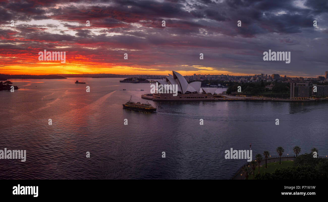 Dramatic sunrise at the Sydney Harbour, with a view of the Sydney Opera House, UNESCO World Heritage Site, Sydney, New South Wales, Australia, Pacific Stock Photo