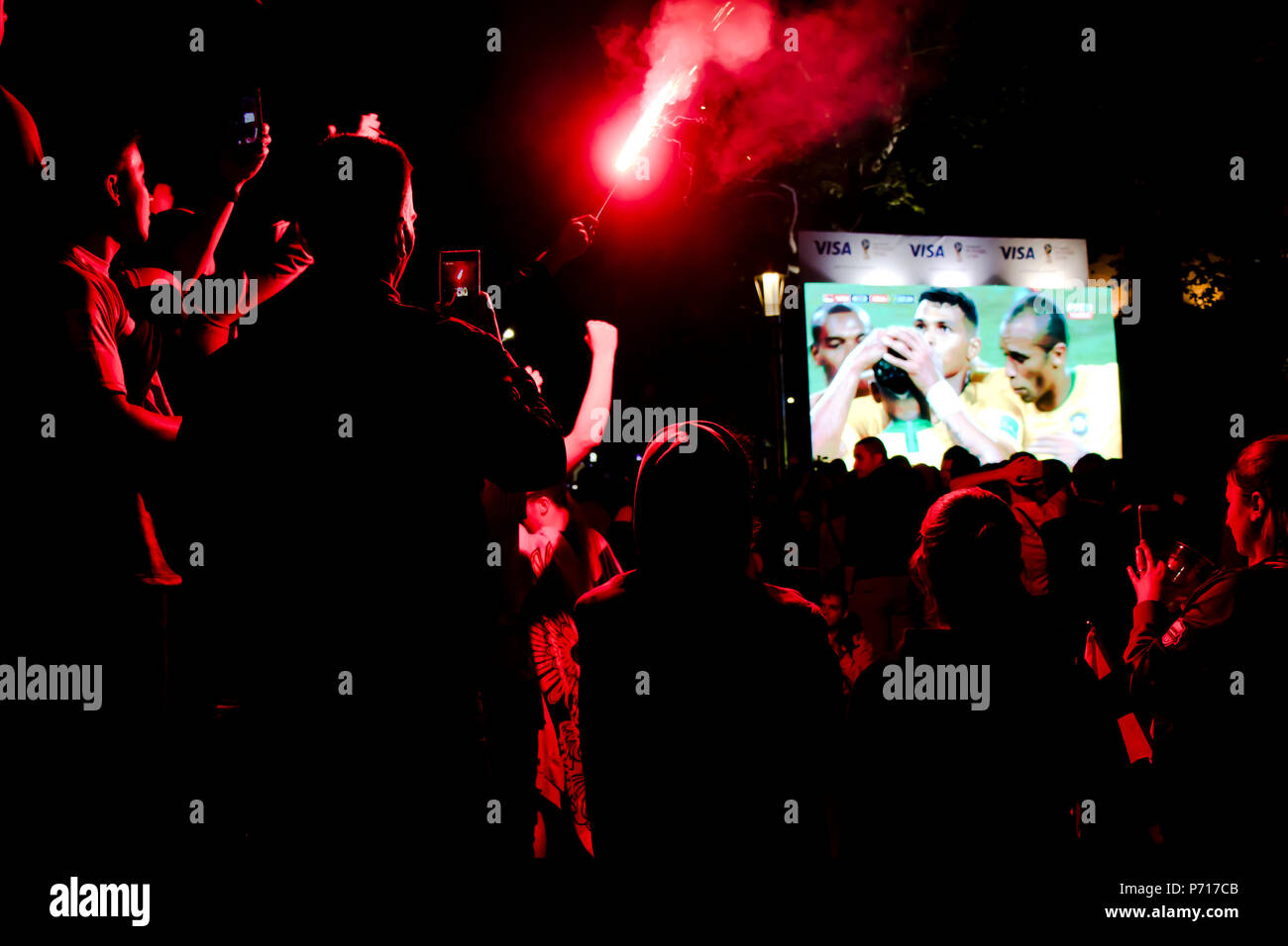 Belgrade, Serbia - June 27, 2018: Crowd of young football fans watching Serbia vs Brasil game in the World cup 2018 on the public huge screen in the s Stock Photo