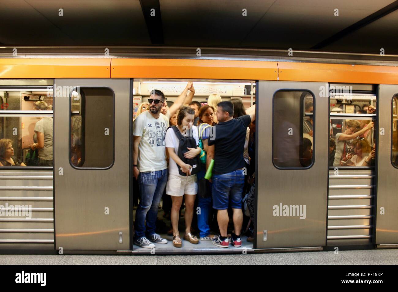 commuters wait on an athens subway train greece Stock Photo