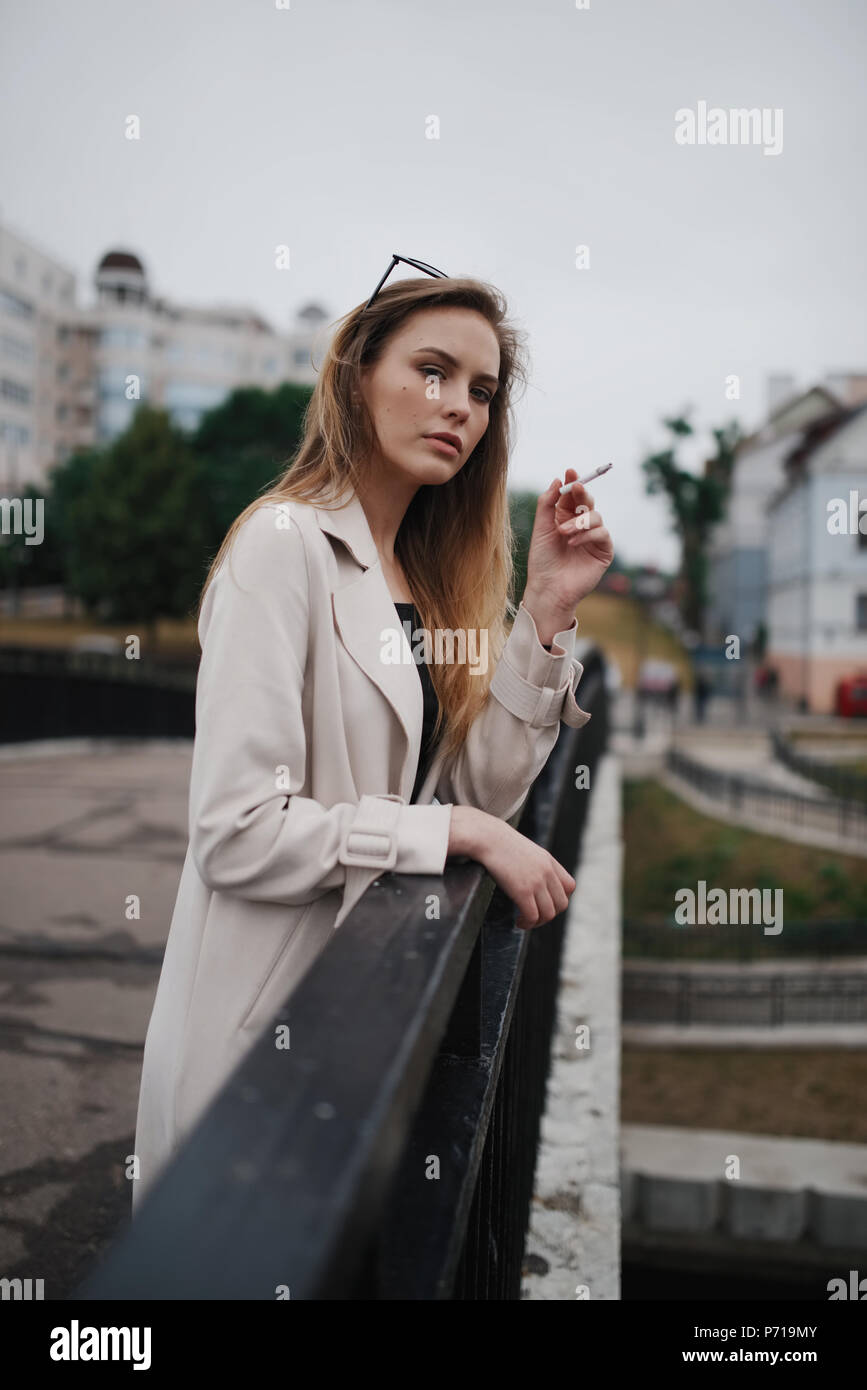 Blonde girl smoking hi-res stock photography and images - Alamy