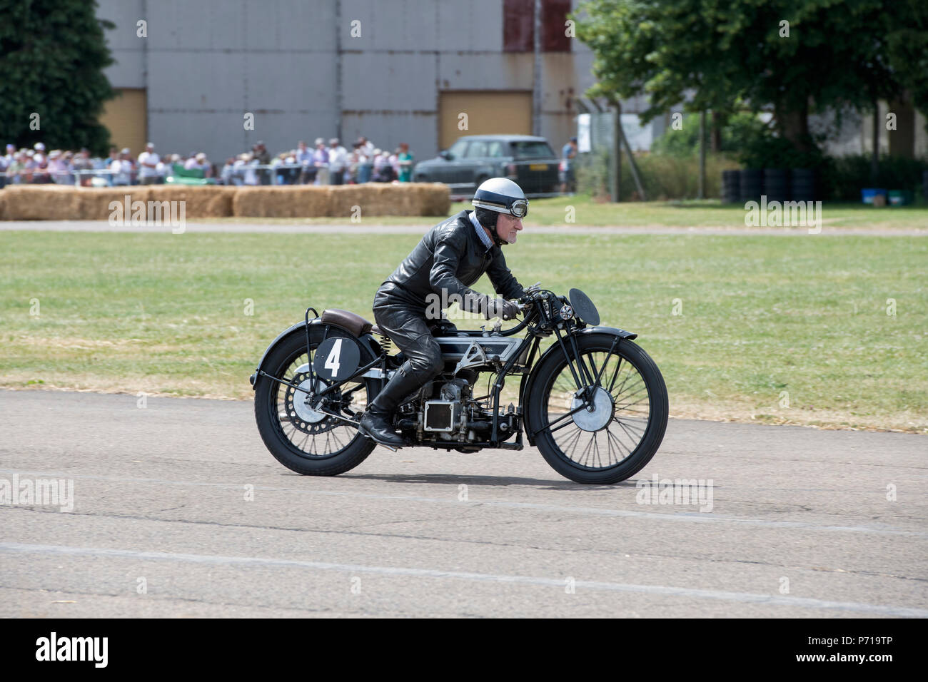 Man racing a 1928 Douglas SW5 Speed model motorcycle at flywheel