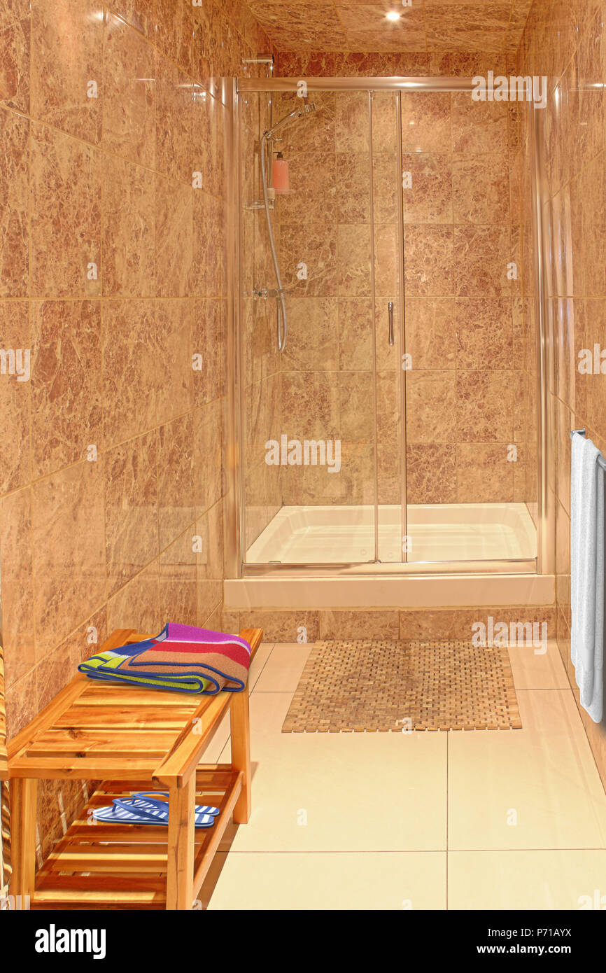 modern tiled shower room with wooden bench Stock Photo - Alamy