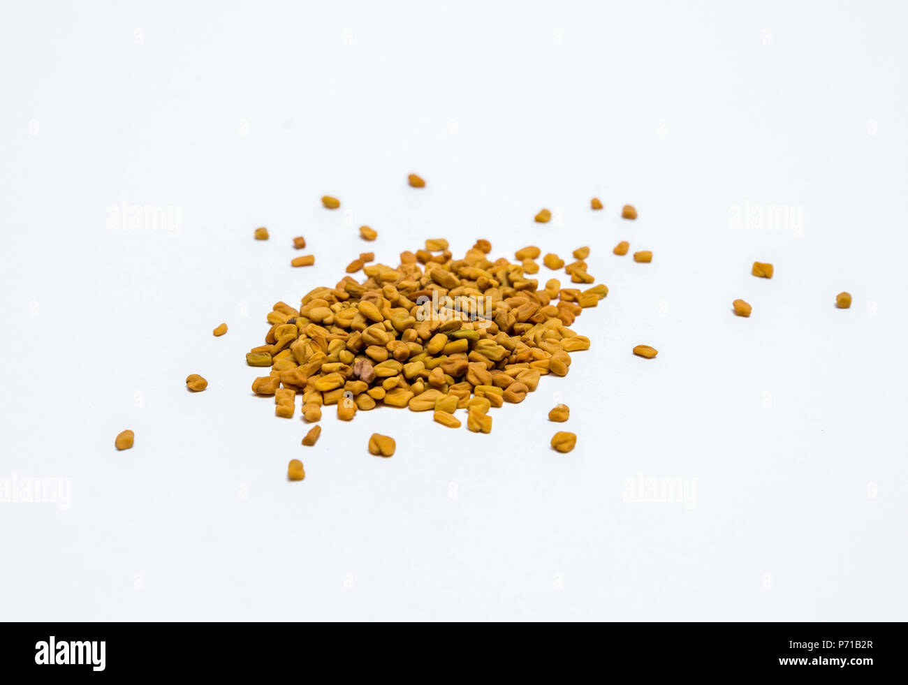 Fenugreek seeds in white background Stock Photo
