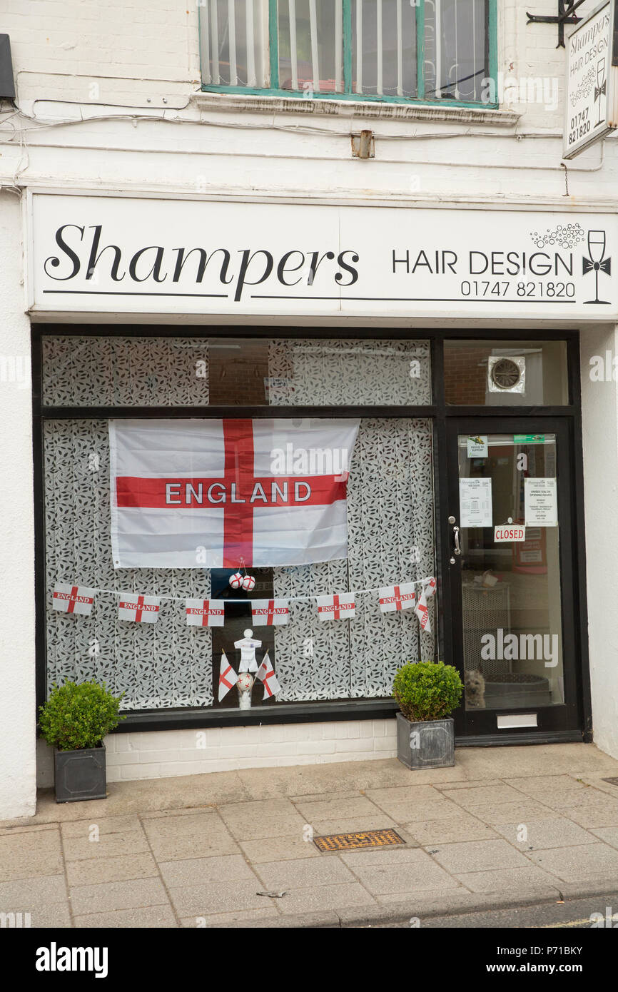 Display in a hairdresser’s shop window during the 2018 Football World Cup supporting England. 3.7.18 North Dorset England UK GB Stock Photo