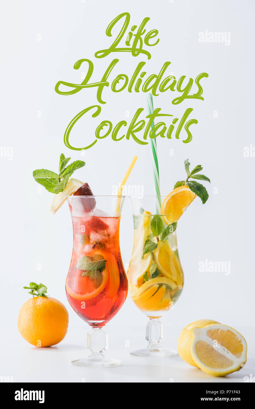 close up view of summer fresh cocktails with lemon and orange pieces ...