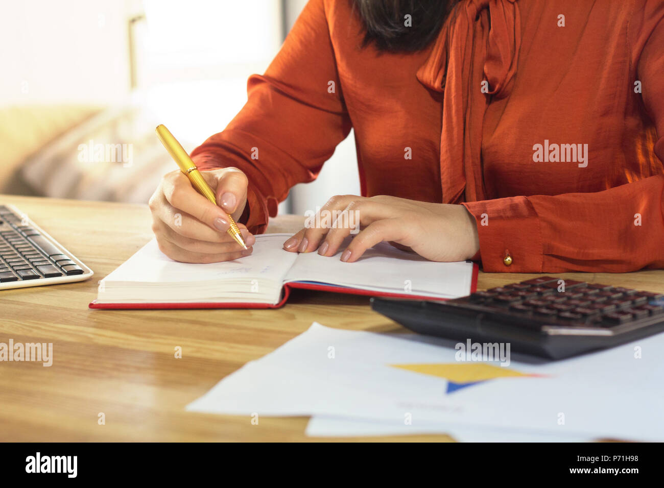 Females hand writing in notebook Stock Photo - Alamy