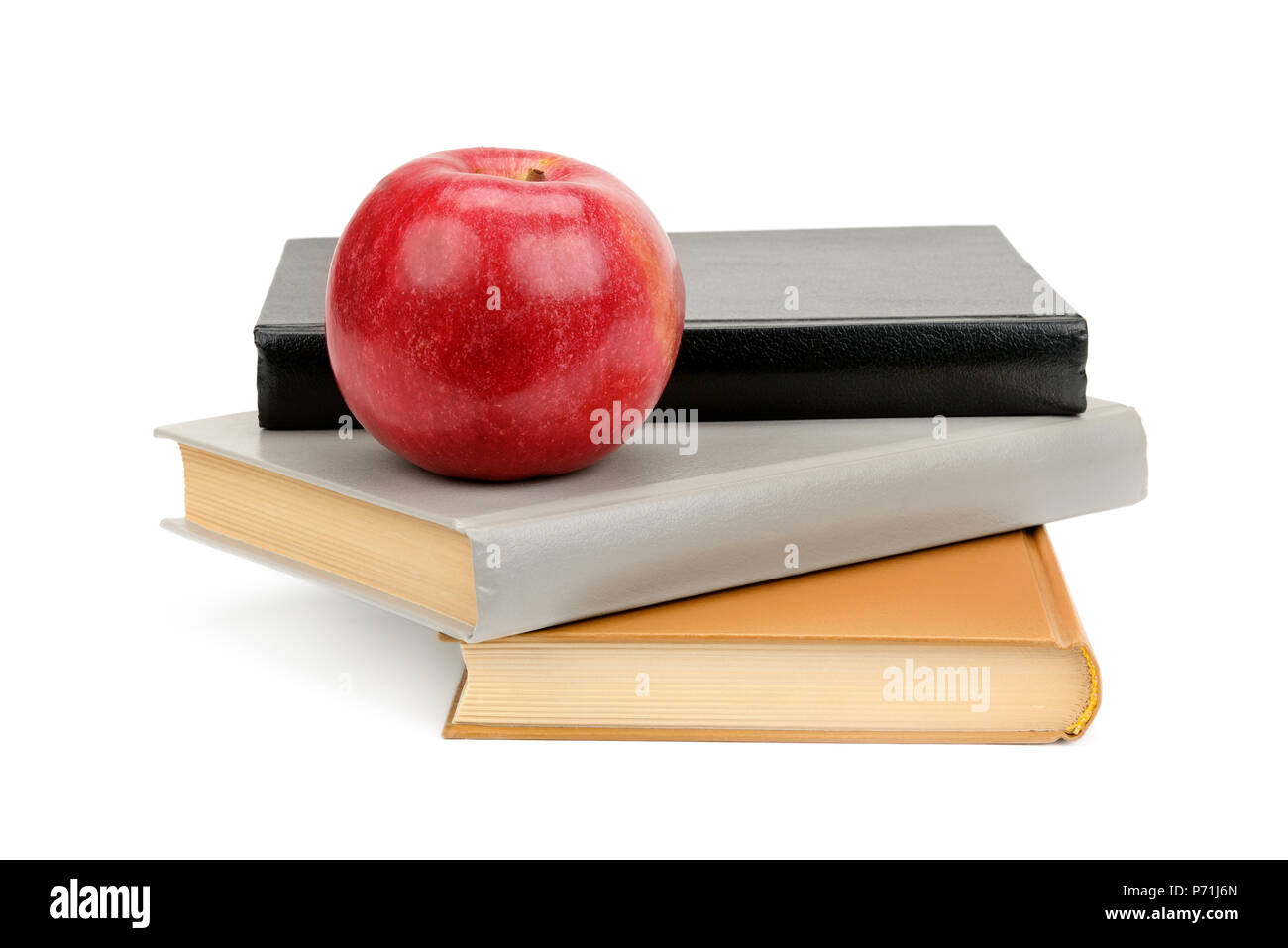 books and apple isolated on white background Stock Photo - Alamy