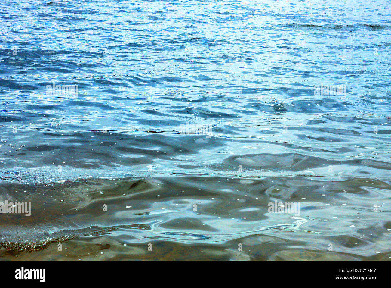 Sea blue water waves background Stock Photo - Alamy