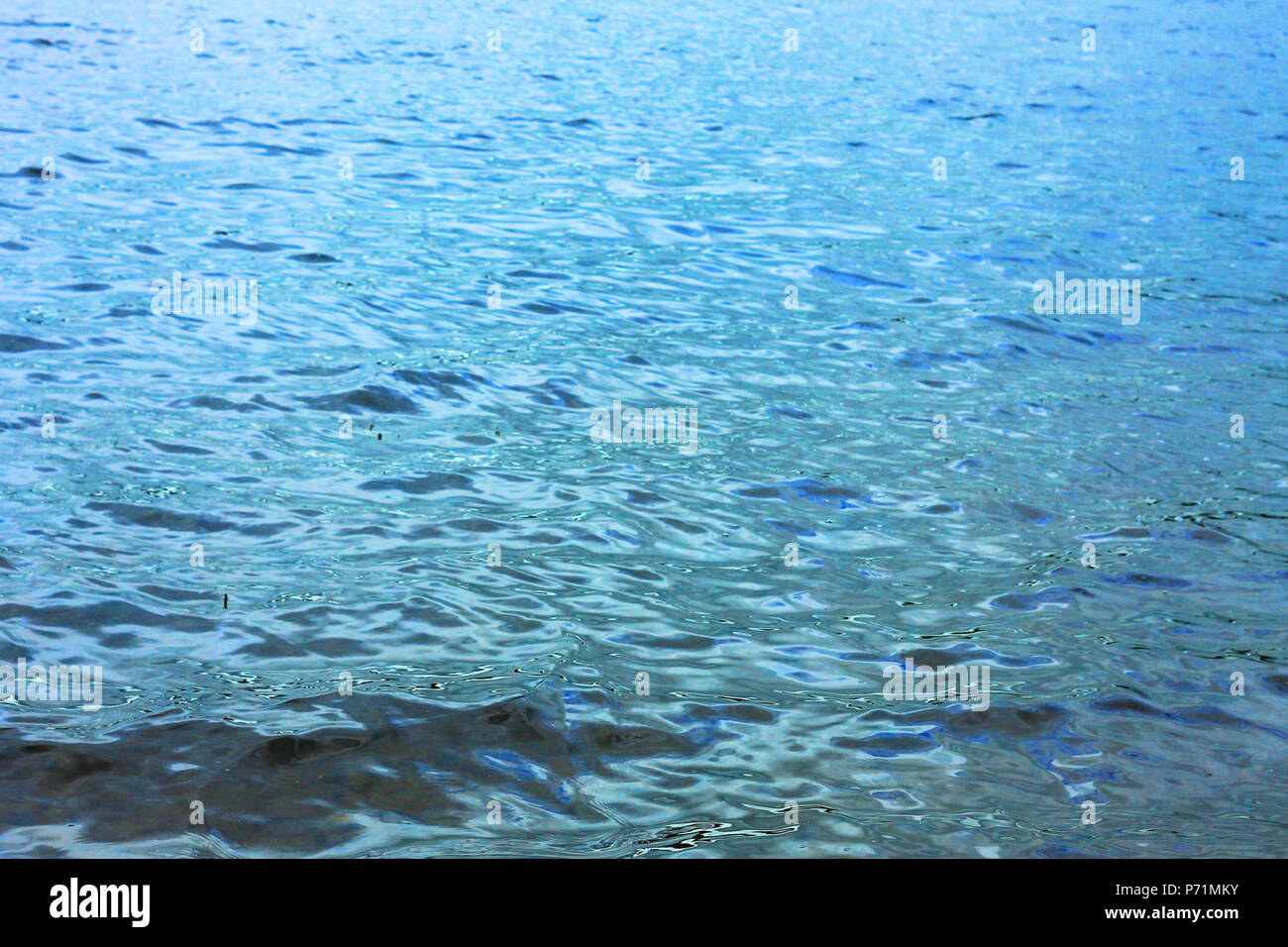 Sea blue water waves background Stock Photo - Alamy