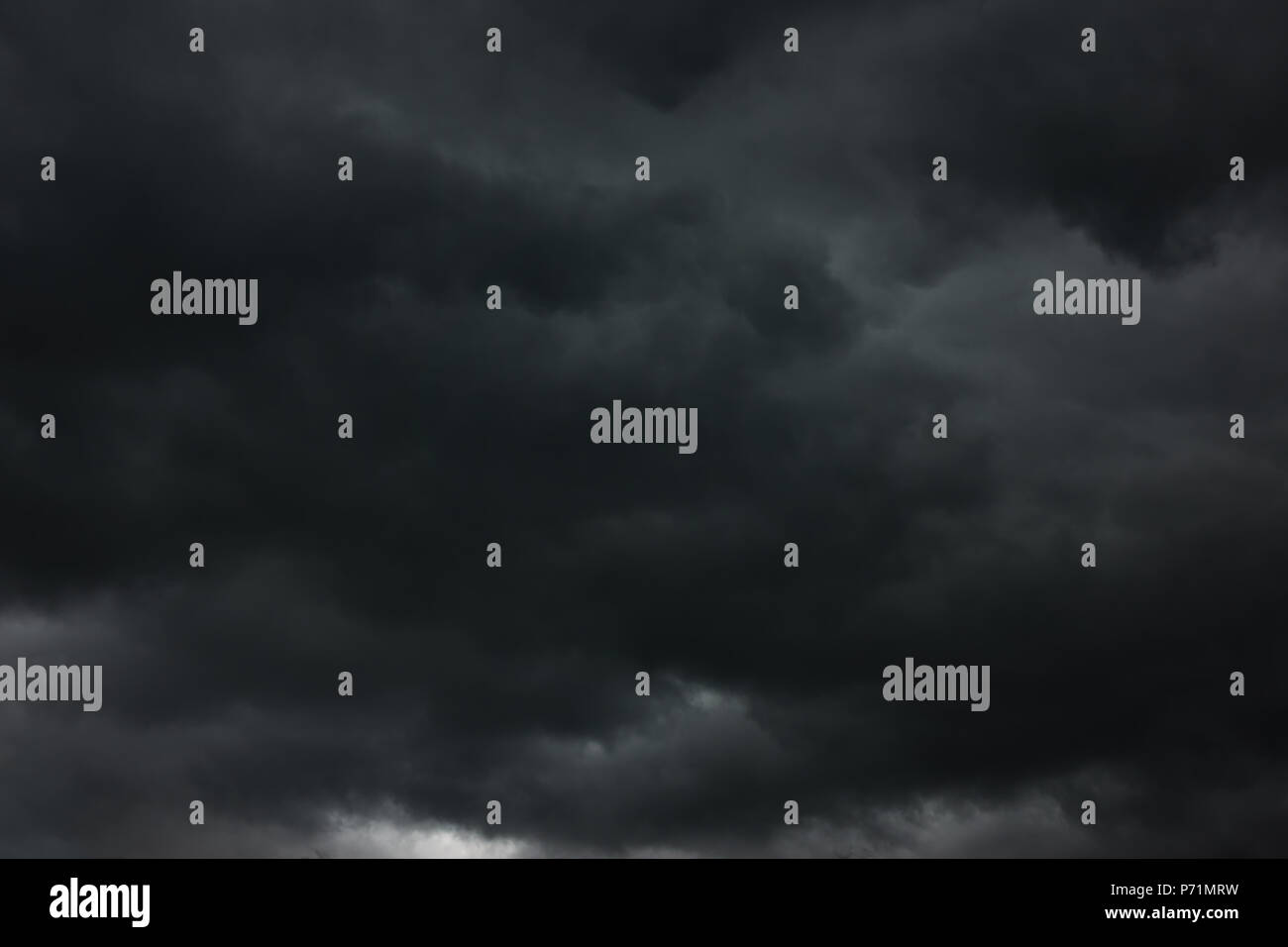 Dramatic sky with black heavy clouds, may be used as background Stock Photo